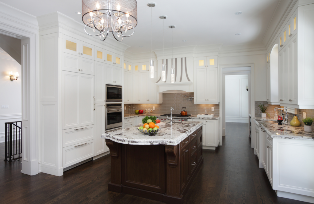 raashi-design-alamo-ca-kitchen-storage-solutions-large-island-with-dark-cabientry-in-white-kitchen-dark-floors-granite-countertops-contemporary