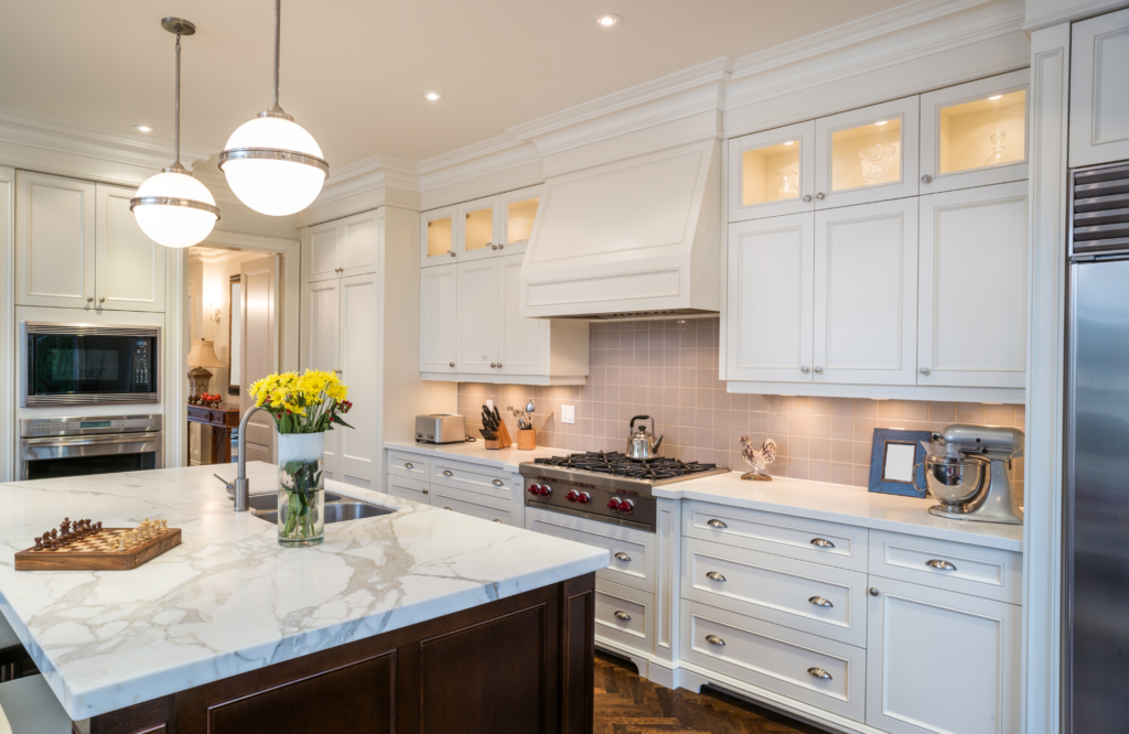 raashi-design-walnut-creek-ca-kitchen-storage-solutions-luxury-kitchen-with-island-and-tall-cabinets-unique-pendants-over-island-elegant-residential-design