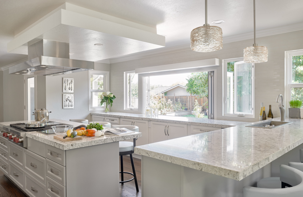 raashi-design-walnut-creek-ca-preparing-your-home-for-spring-and-warm-weather-bright-white-kitchen-with-large-windows-natural-light-elegant-contemporary-interior-design