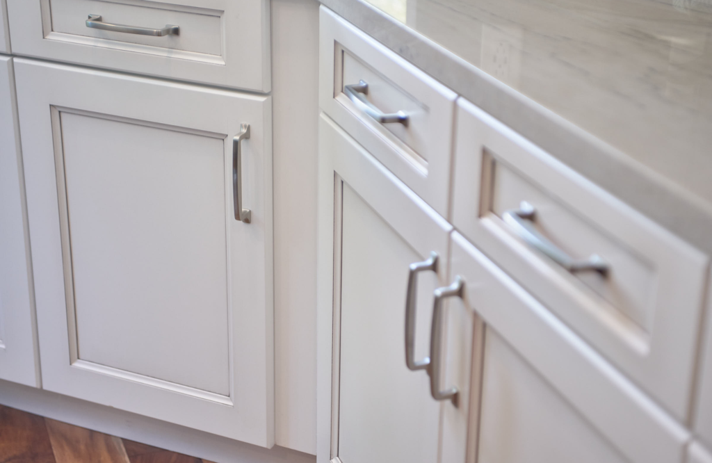 raashi-design-laundry-room-organization-white-cabinets-nickel-hardware-contemporary-elegant-laundry-room-design