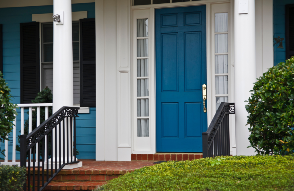 raashi-design-san-ramon-choosing-exterior-color-palette-transitional-home-exterior-blue-front-door