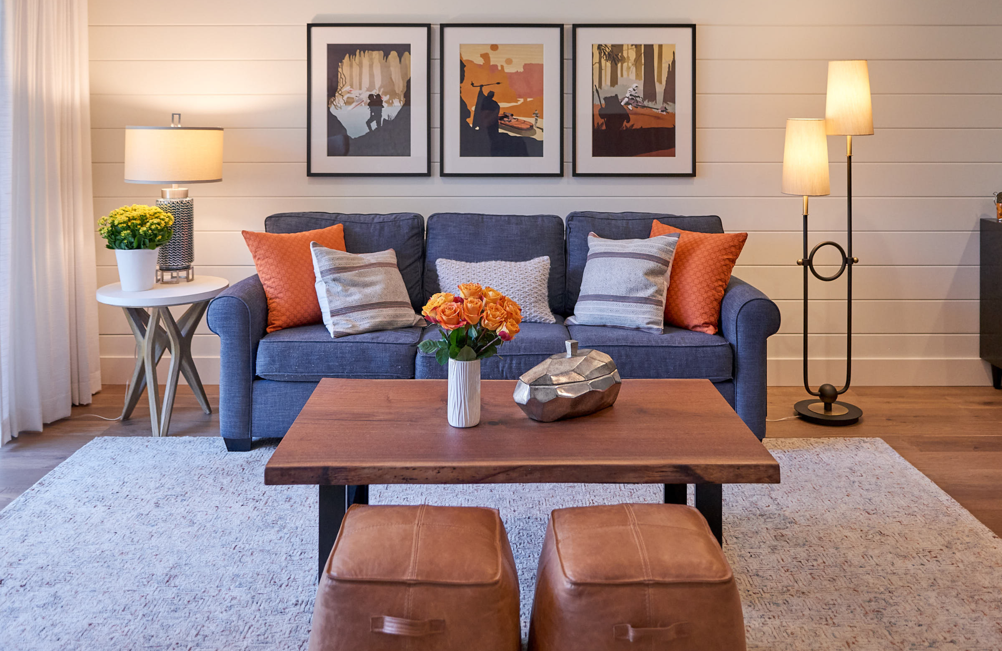 raashi-design-walnut-creek-ca-questions-to-ask-before-hiring-an-interior-designer-blue-sofa-orange-accents-leather-ottomans-elegant-contemporary-interior-design