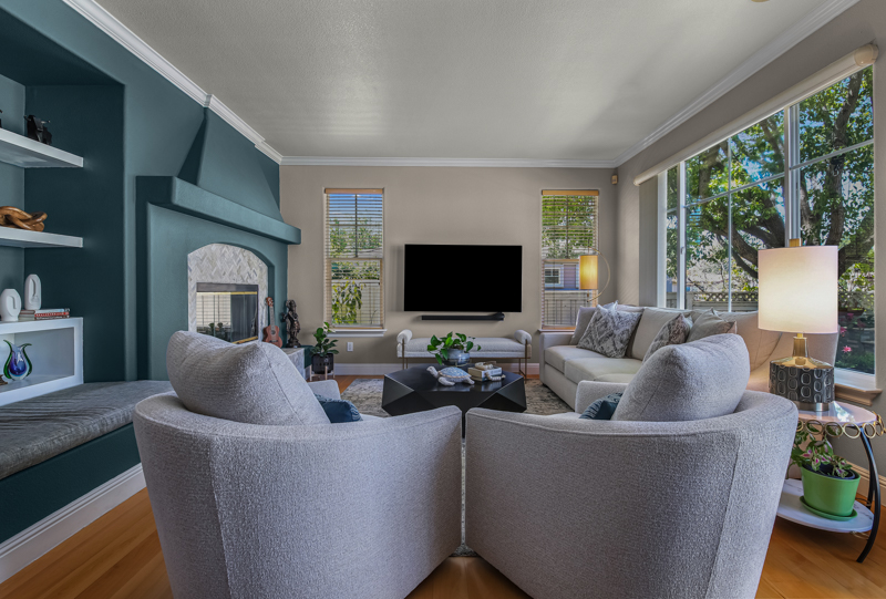 full-service-interior-design-pleasanton-ca-open-vs-closed-floor-plans-cozy-living-room-deep-teal-build-in-cabinetry-large-window-delight-design