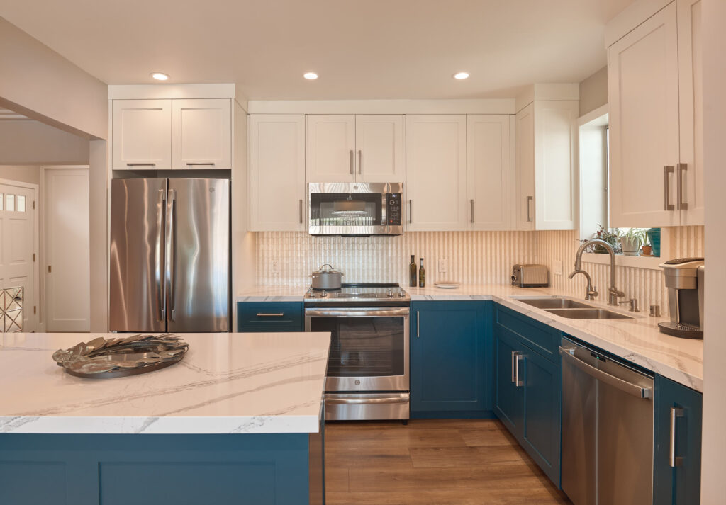 raashi-design-berkeley-ca-post-interior-design-project-care-renovated-kitchen-blue-and-white-cabinets-stone-countertop-elegant-virtual-design