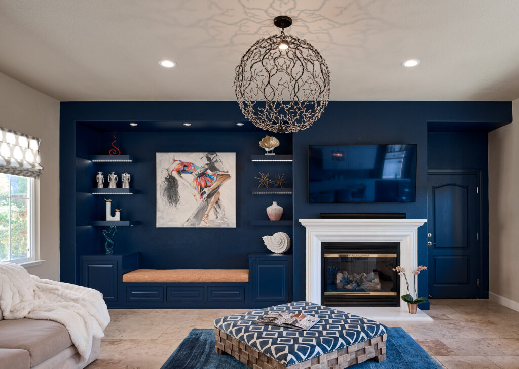 raashi-design-danville-ca-scale-and-proportion-interior-design-living-room-deep-blue-focal-wall-built-in-cabinetry-fireplace-large-light-fixture-luxury