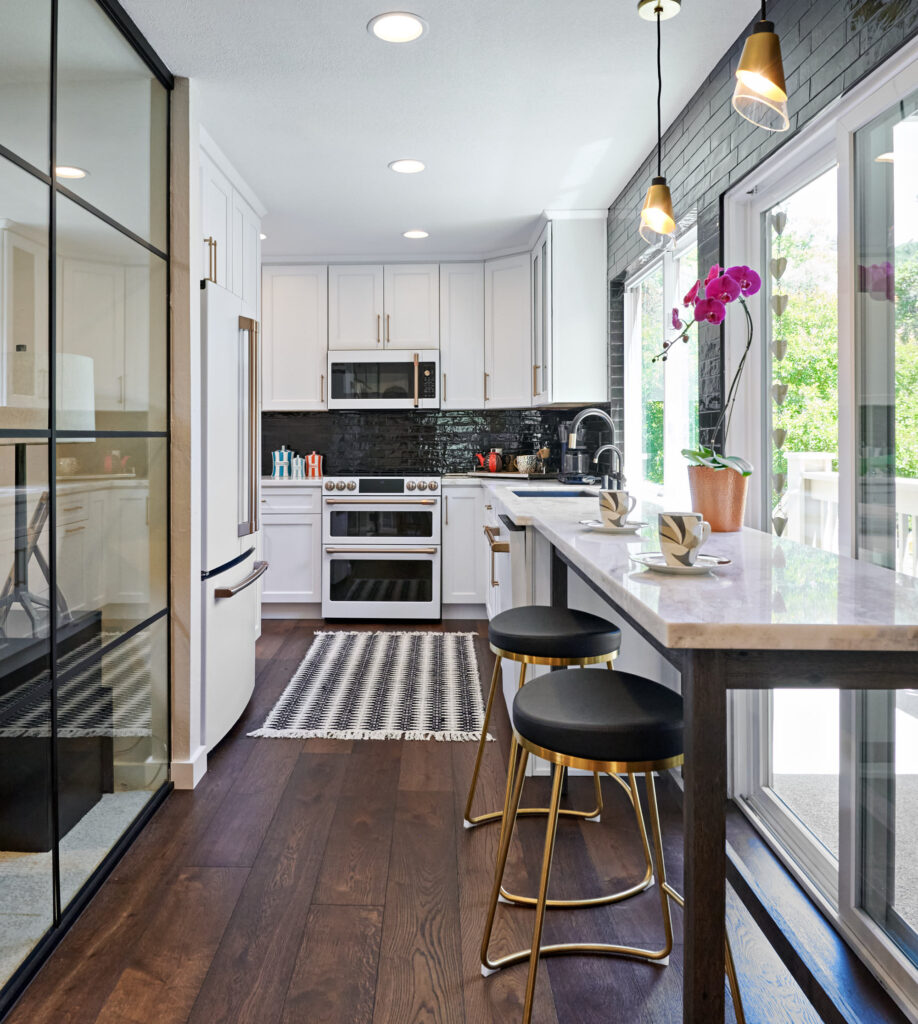 raashi-design-walnut-creek-ca-factors-in-interior-design-investment-small-modern-kitchen-with-glass-wall-large-windows-black-and-white-elegant-design